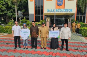 BPJS Ketanagakerjaan dan Pemkot Depok Serahkan Santunan kepada Petugas Adhoc Pemilu 2024